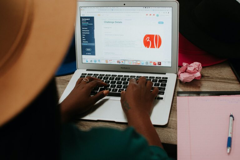 Image of lady with hands on laptop